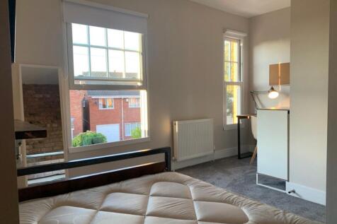 This charming double bedroom features ample nat...