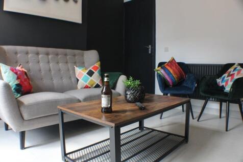 A stylish and inviting living room featuring co...