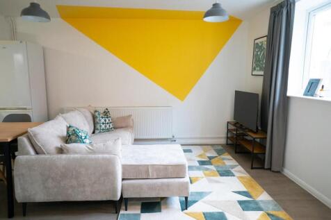 A stylish and spacious modern living room, perf...