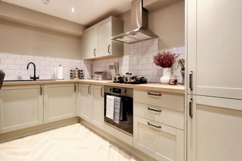 A stylish and modern kitchen featuring sleek ca...
