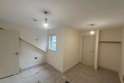 A bright and inviting hallway space with potent...