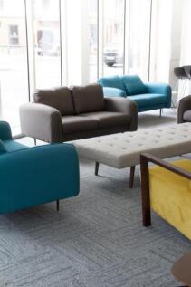 A bright and inviting communal lounge area feat...