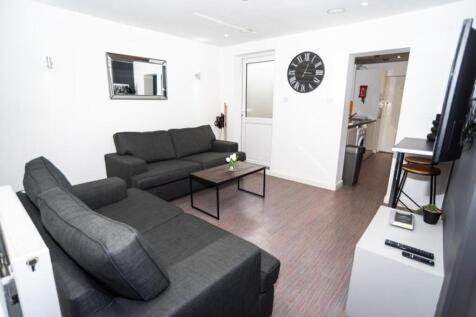 A stylish and inviting living room featuring co...