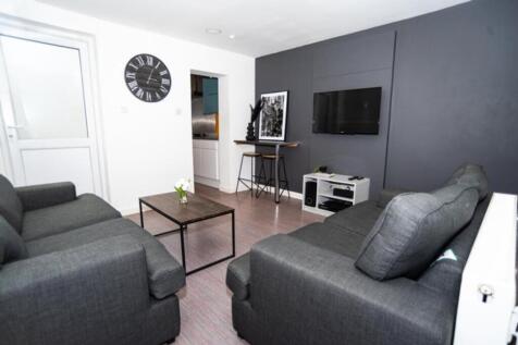 A stylish living room featuring modern furnitur...