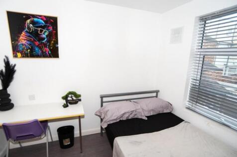 Inviting double bedroom featuring natural light...