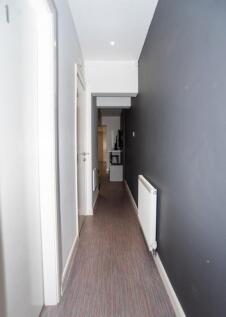 A well-lit and tidy hallway featuring modern de...