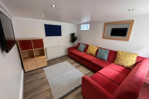 This inviting living room features a spacious r...