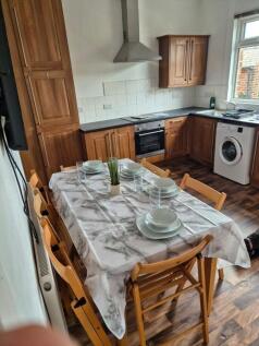 A bright and inviting kitchen featuring modern ...