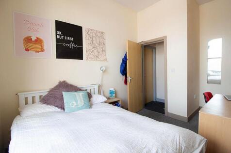This cozy double bedroom features stylish decor...