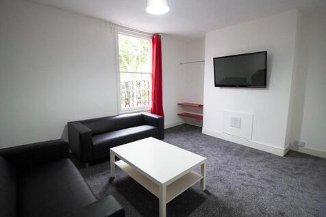 Bright and modern living room featuring comfort...