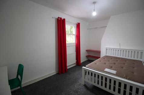A bright and inviting double bedroom featuring ...