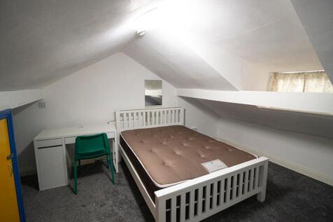 Bright and cozy double bedroom featuring a comf...