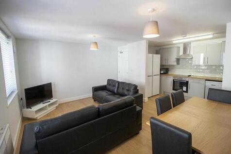 A modern and inviting living room featuring com...