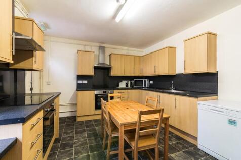 This spacious kitchen features ample storage wi...