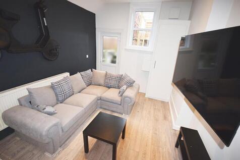 This stylish living room features a comfortable...