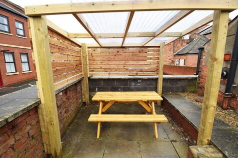 A charming and well-maintained garden space fea...