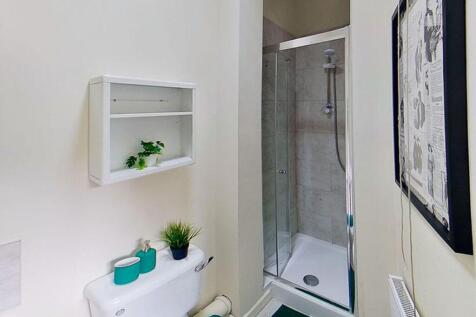 This modern bathroom features a sleek shower wi...