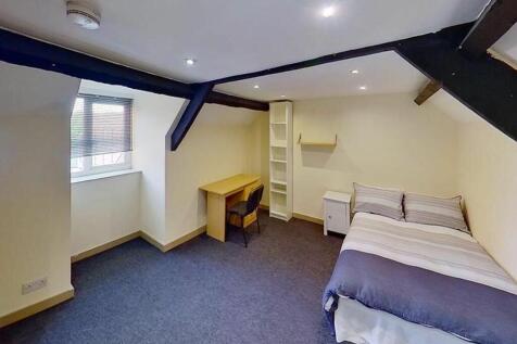 Spacious double bedroom featuring a comfortable...