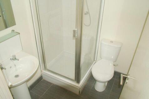 A clean and modern bathroom featuring a sleek s...