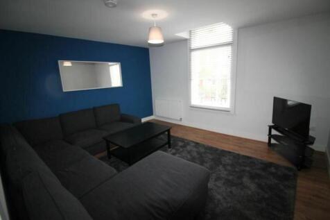 Spacious and inviting living room featuring a m...