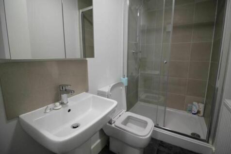 A modern bathroom featuring a sleek design with...