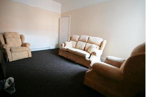 Cozy living room featuring comfortable seating,...