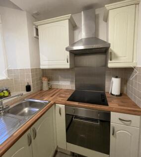 A clean and functional kitchen space featuring ...