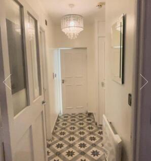 A stylish and well-maintained hallway with eleg...