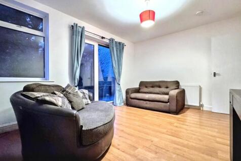 A spacious and inviting modern living room, per...