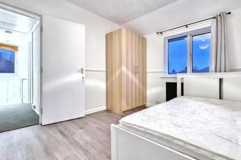 A bright and spacious double bedroom with ample...