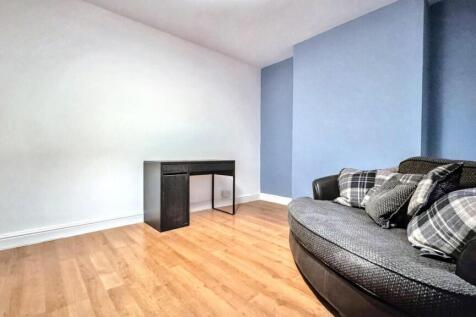 A bright and inviting living room with modern d...