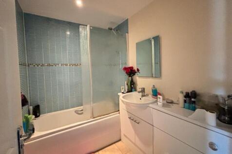 A beautifully designed bathroom suite featuring...