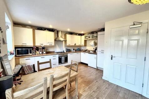 This modern kitchen boasts ample storage and wo...