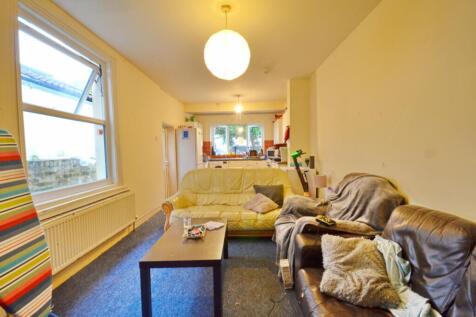 A spacious and inviting living room featuring c...