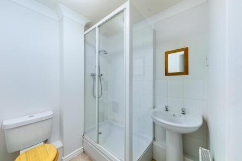A clean and well-maintained bathroom featuring ...
