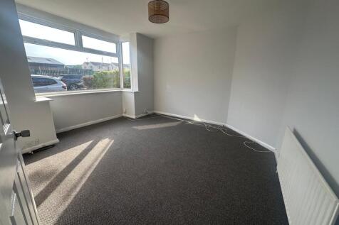 Bright and airy double bedroom featuring a larg...