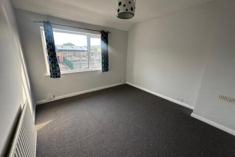 Bright and fresh double bedroom featuring a lar...
