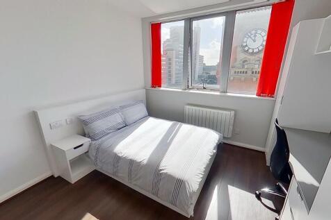 Bright and inviting double bedroom featuring la...