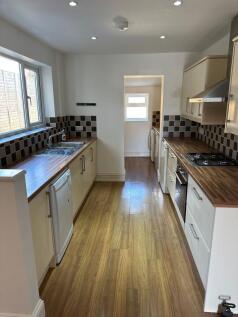 This contemporary kitchen features ample counte...