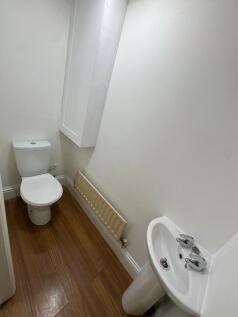 This well-maintained single toilet features a s...