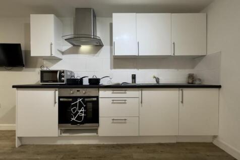 A modern and clean kitchenette featuring sleek ...