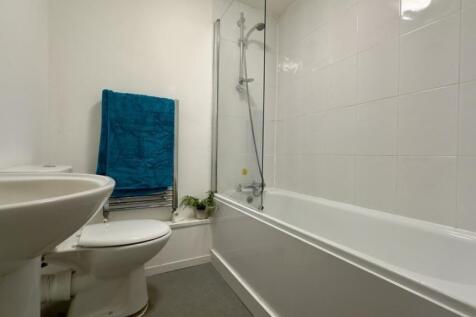 A clean and tidy bathroom featuring modern fixt...