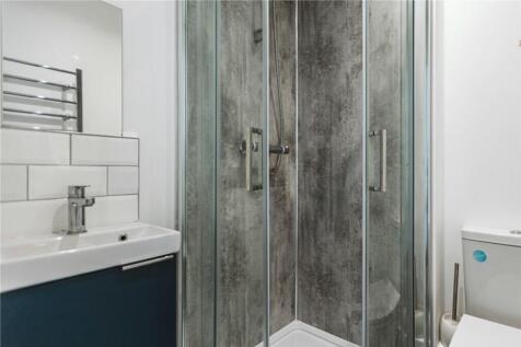 This contemporary bathroom features a sleek des...