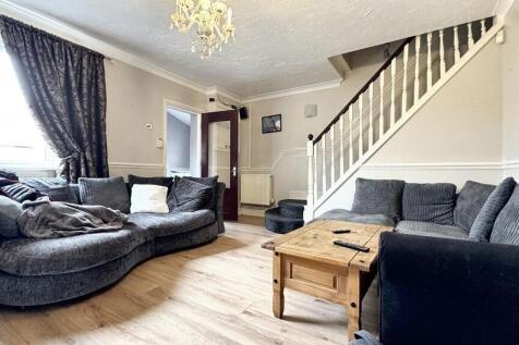 A cozy living room featuring a spacious section...
