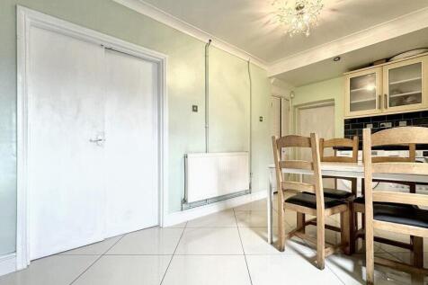 Bright and spacious kitchen area featuring a co...
