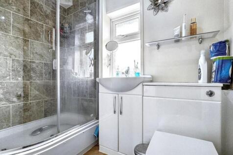 A modern bathroom featuring a sleek design with...