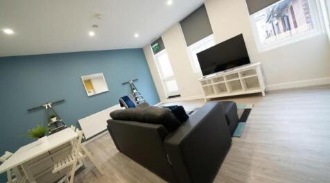 This modern living room features a spacious lay...