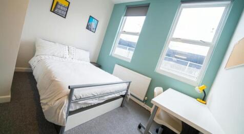 Bright and cozy double bedroom featuring large ...