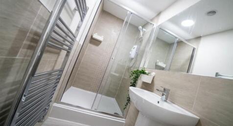 Experience a modern bathroom suite featuring a ...