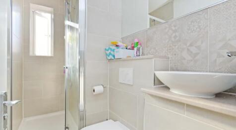 This modern bathroom features a sleek design wi...